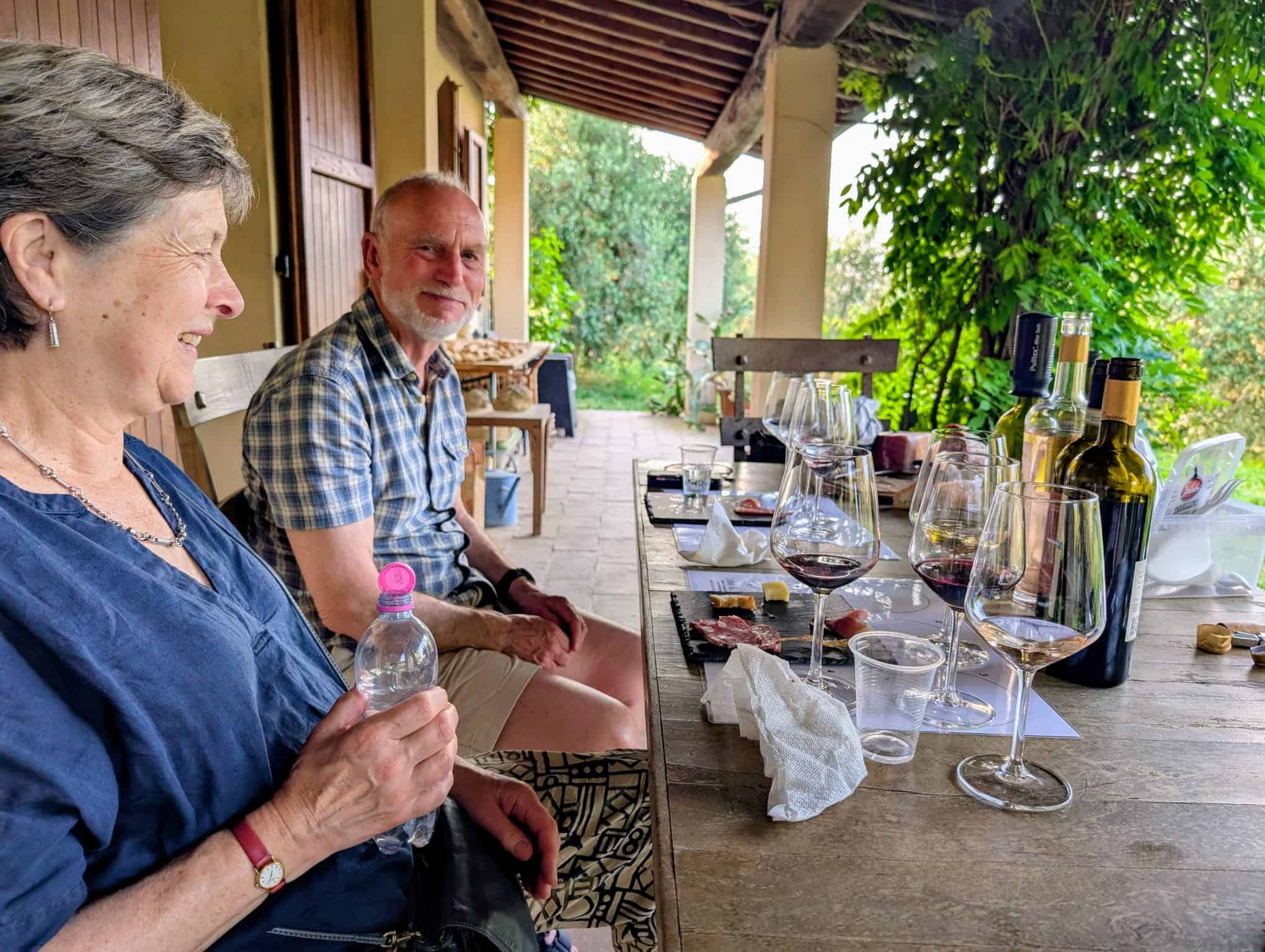 wine-tasting-hosts-and-guests.jpg Divini Incontri hosts with guests at a Tuscan wine tasting session